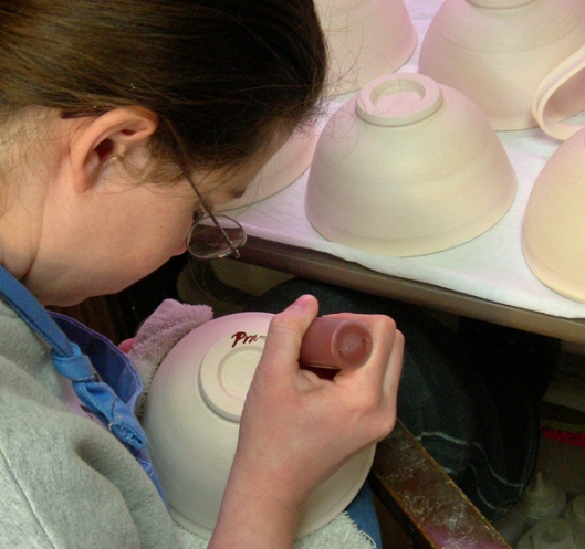 Emily signing pots